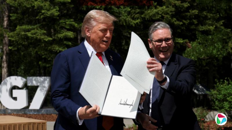 ͳӢ˹ĬߴҵţG7ڼ䣬ͬչʾһǩóЭ